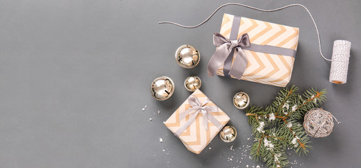 Composition with beautiful Christmas gift boxes on grey background