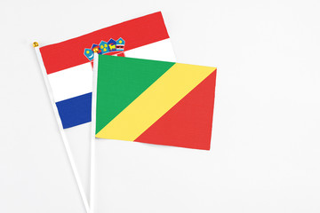 Republic Of The Congo and Croatia stick flags on white background. High quality fabric, miniature national flag. Peaceful global concept.White floor for copy space.