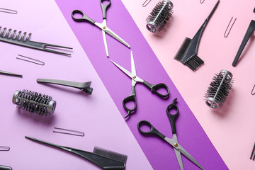 Set of hairdresser tools on color background