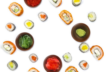 Composition with different sushi on white background