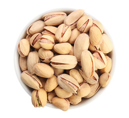 Bowl with tasty pistachio nuts isolated on white