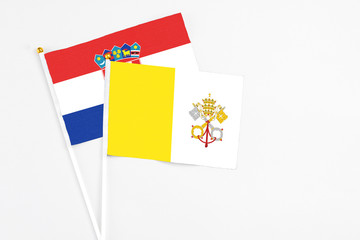 Vatican City and Croatia stick flags on white background. High quality fabric, miniature national flag. Peaceful global concept.White floor for copy space.