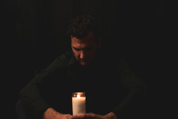 Attractive Male Model Studio Portraits with Candle and praying