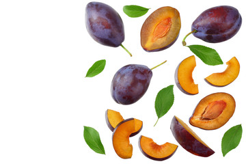 fresh plum fruit with green leaf and cut plum slices isolated on white background. top view