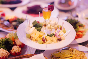 Table with mixed food. Banquet in restaurant, table setting. Differend meals for the guests. Fresh food