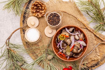 Pickled (fermented) mushrooms. Traditional New Year (Christmas) snack. Festive table cutlery setting