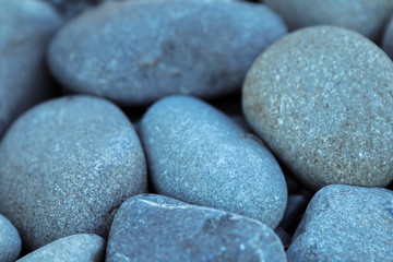Fototapeta na wymiar Several stones on the ground by a lake