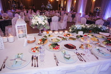 Element of decor in restaurant. Decoration on wedding. A chic tables in restaurant