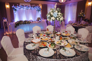 Element of decor in restaurant. Decoration on wedding. A chic tables in restaurant