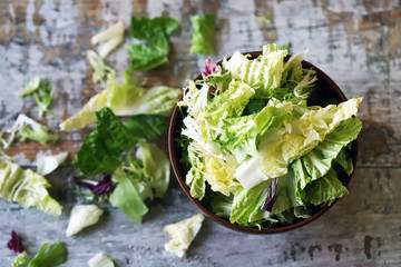 Mix of salads in a bowl. Green juicy lettuce leaves. The concept of a healthy diet. Selective focus. Macro.