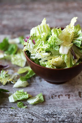 Mix of salads in a bowl. Green juicy lettuce leaves. The concept of a healthy diet. Selective focus. Macro.