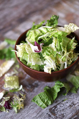Mix of salads in a bowl. Green juicy lettuce leaves. The concept of a healthy diet. Selective focus. Macro.