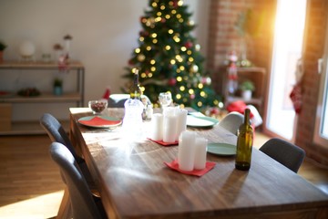 Nice home with tree, decorations and table with food prepared to celebrate Christmas.