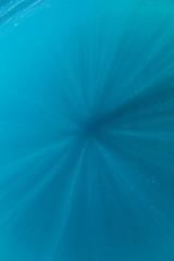Beams of sunlight descend into the depths of the tropical Pacific Ocean.