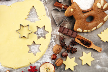Baking christmas cookies. Typical cinnamon stars bakery with spices. xmas decoration on table