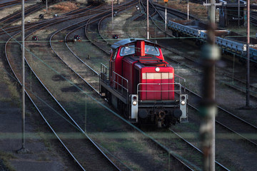red shunter train on an train cargo station