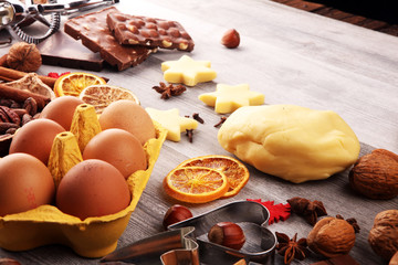 Baking christmas cookies. Typical cinnamon stars bakery with spices. xmas decoration on table