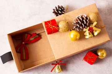 Christmas gifts in craft paper on a gray background with decorations.