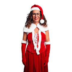Middle age woman wearing Santa Claus costume with a happy and cool smile on face. Lucky person.