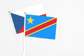 Congo and Cyprus stick flags on white background. High quality fabric, miniature national flag. Peaceful global concept.White floor for copy space.