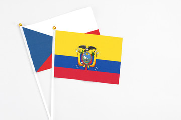 Ecuador and Cyprus stick flags on white background. High quality fabric, miniature national flag. Peaceful global concept.White floor for copy space.