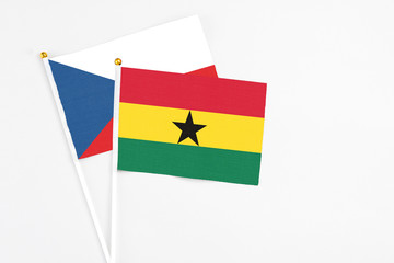 Ghana and Cyprus stick flags on white background. High quality fabric, miniature national flag. Peaceful global concept.White floor for copy space.