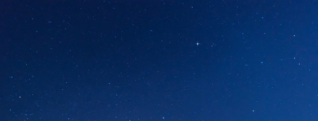 Panorama blue night sky milky way and star on dark background.Universe filled with stars, nebula and galaxy with noise and grain.Photo by long exposure and select white balance.selection focus.amazing