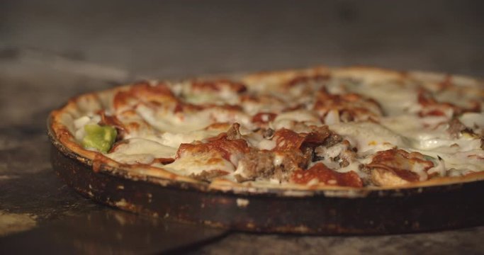 Closeup Of A Hot Gourmet Pizza, Cheese Bubbling From Heat.