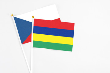 Mauritius and Cyprus stick flags on white background. High quality fabric, miniature national flag. Peaceful global concept.White floor for copy space.