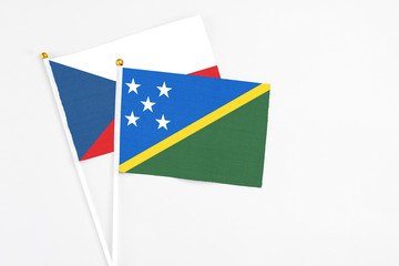 Solomon Islands and Cyprus stick flags on white background. High quality fabric, miniature national...