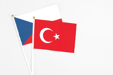 Turkey and Cyprus stick flags on white background. High quality fabric, miniature national flag. Peaceful global concept.White floor for copy space.