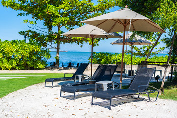Umbrella and chair on the beach and sea with blue sky