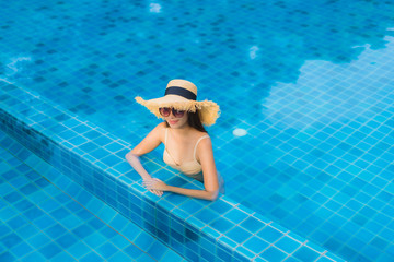 Portrait beautiful young asian women happy smile relax outdoor swimming pool in resort