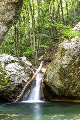 A small waterfall in the forest. Waterfall in Crimea.