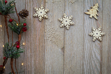 Fototapeta premium Holiday Christmas Winter concept with ornaments on wooden board, flat lay, text copy space
