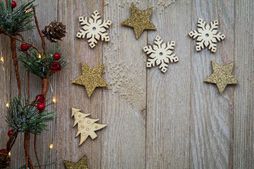 Fototapeta premium Holiday Christmas Winter concept with ornaments on wooden board, flat lay, text copy space