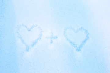 Drawing of two hearts on a background of white snow. Merry Christmas and New year concept. Valentine's day.