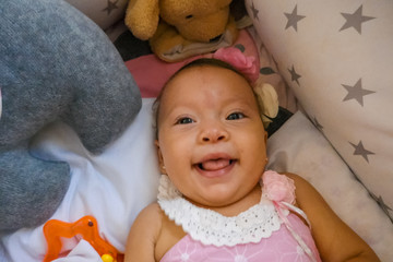 A lovely little girl in her crib