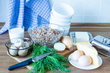 Ingredients for cooking buckwheat casserole with mushrooms. Products for cooking a delicious dish. Wholesome food.