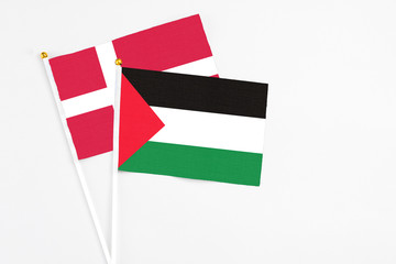 Palestine and Denmark stick flags on white background. High quality fabric, miniature national...