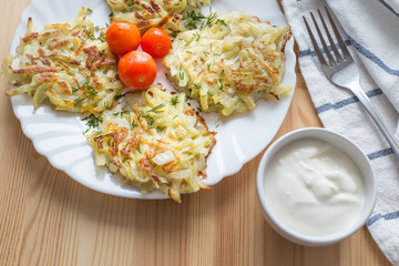 Potato pancakes on a blue plate. Russian national dish.