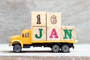 Truck hold letter block in word 16jan on wood background (Concept for date 16 month January)
