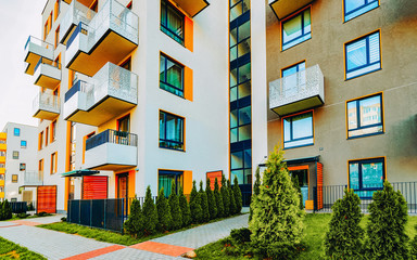 Modern residential apartments with flats building exterior with outdoor facilities. New luxury...