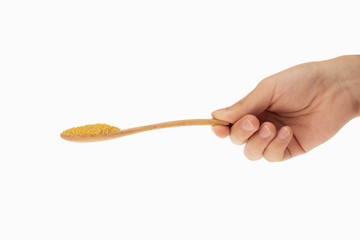 millet in spoon with white background