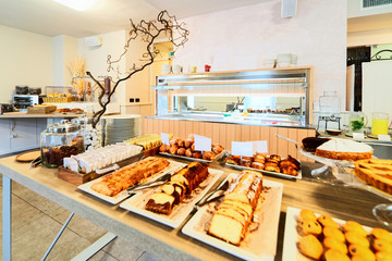 Hotel sweet cakes pastry breakfast restaurant interior background. Architecture white room with food. Bar table. Light Vintage style. Morning design. Cafe menu. Lunch, dinner snack. Modern lifestyle