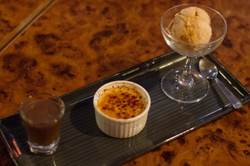 dessert platter of creme brulee and arrogato with espresso and vanilla ice cream