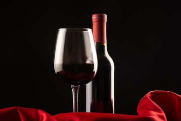 close up of an elegant gourmet cup and wine bottle in the studio