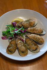 baked green lip mussels with white miso butter, brioche crumbs chives