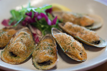 baked green lip mussels with white miso butter, brioche crumbs chives