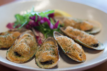 baked green lip mussels with white miso butter, brioche crumbs chives